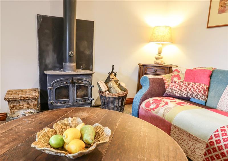 Relax in the living area at Southcott Farm Cottage, Sheldon