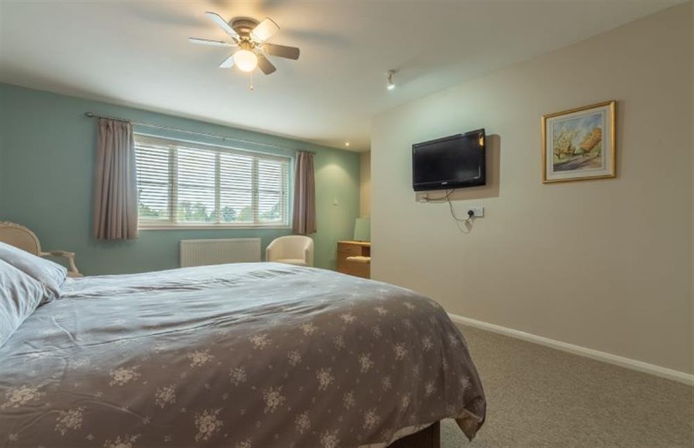 First floor: Bedroom with wall-mounted television with Freeview at Southview Annexe, Sculthorpe near Fakenham