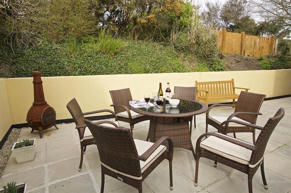 Good sized private terrace to the rear of the property with table, benches and barbecue