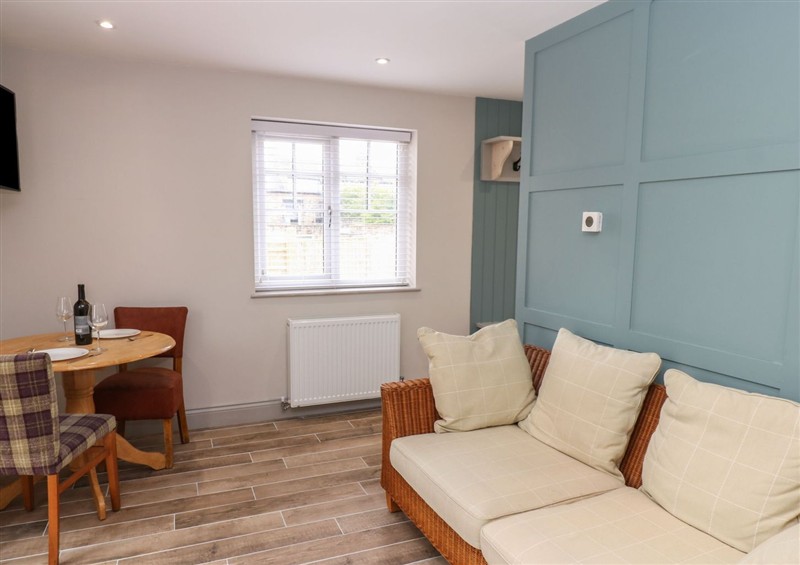 Relax in the living area (photo 2) at Spacious Cottage Number 10, Brandon