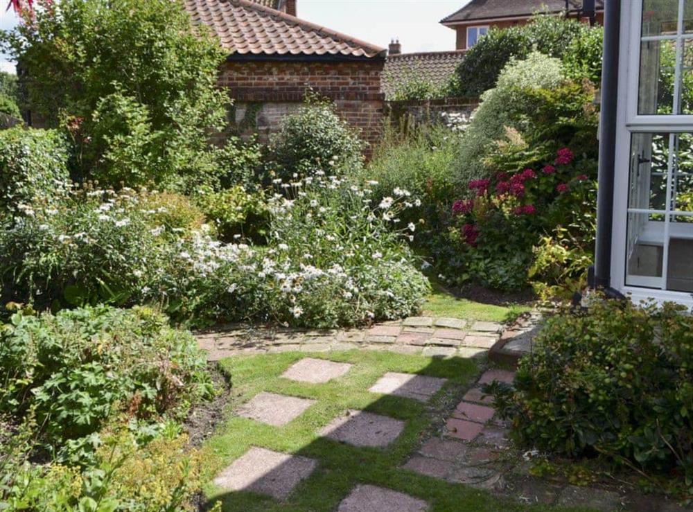 Pretty garden to the front at Speedwell Cottage in Trunch, near North Walsham, Norfolk