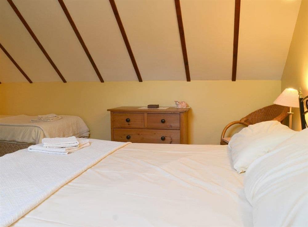 Second en-suite family bedroom with a double and a single bed (photo 2) at Speke’s Retreat in Hartland, Devon