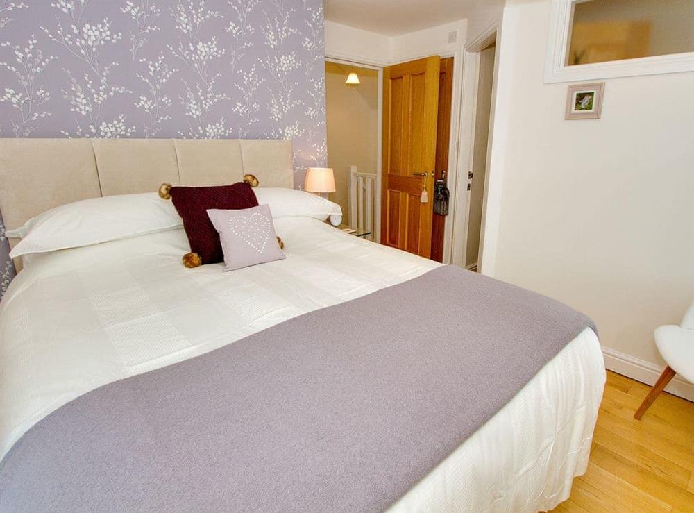 Comfy bedroom with kingsize bed at Spice Mill Cottage in Kirkby Lonsdale, Cumbria