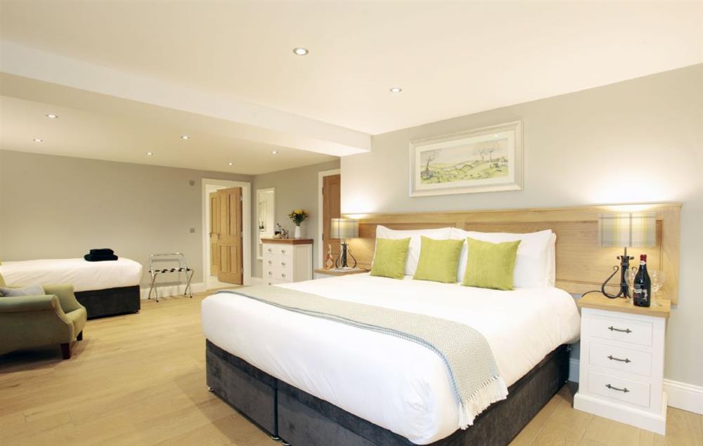 First floor: Double bedroom with zip and link bed and one single bed at Spicer Manor, Ingbirchworth