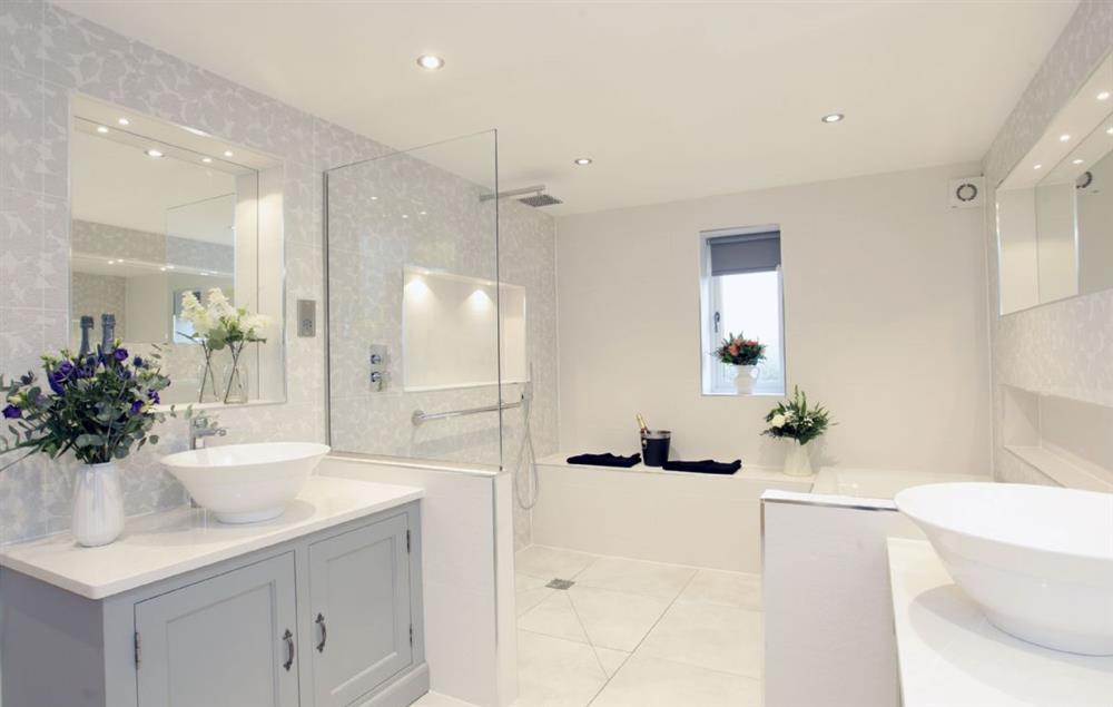 Ground floor: Ensuite with walk in shower with seat, separate bath and two sinks at Spicer Manor, Ingbirchworth