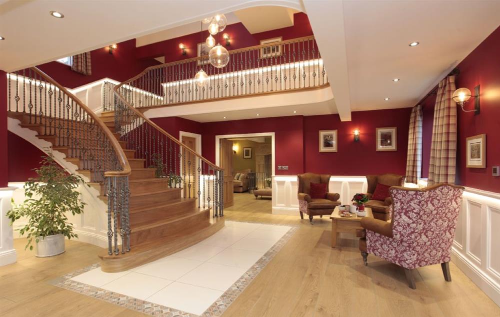 Ground floor: Grand hall with stunning curved oak staircase with elegant staircase  at Spicer Manor, Ingbirchworth