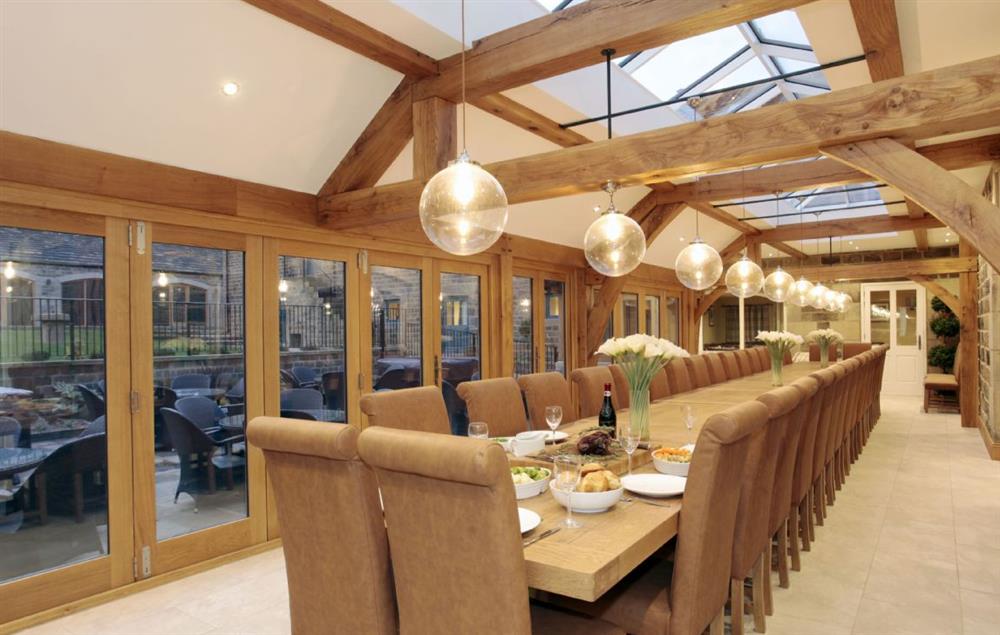 Ground floor: Orangery with oak dining table will comfortably seat 36 guests and bi fold doors leading out to the patio