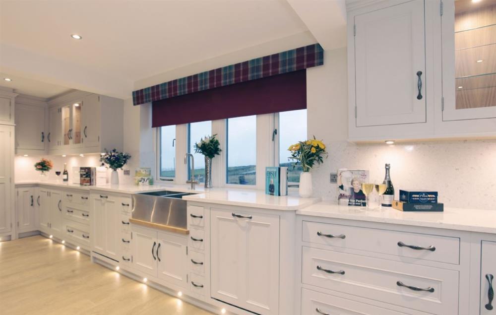 Ground floor: The luxuriously modern and fully equipped kitchen with two american style fridge freezers and four ovens