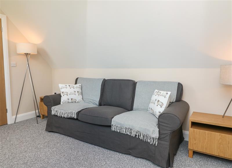 Relax in the living area at Spicery Barn Loft, Tedburn St Mary