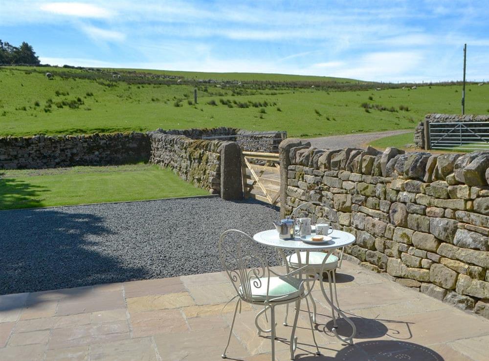 Charming patio area at Spindlewell Barn in Elsdon, near Otterburn, Northumberland