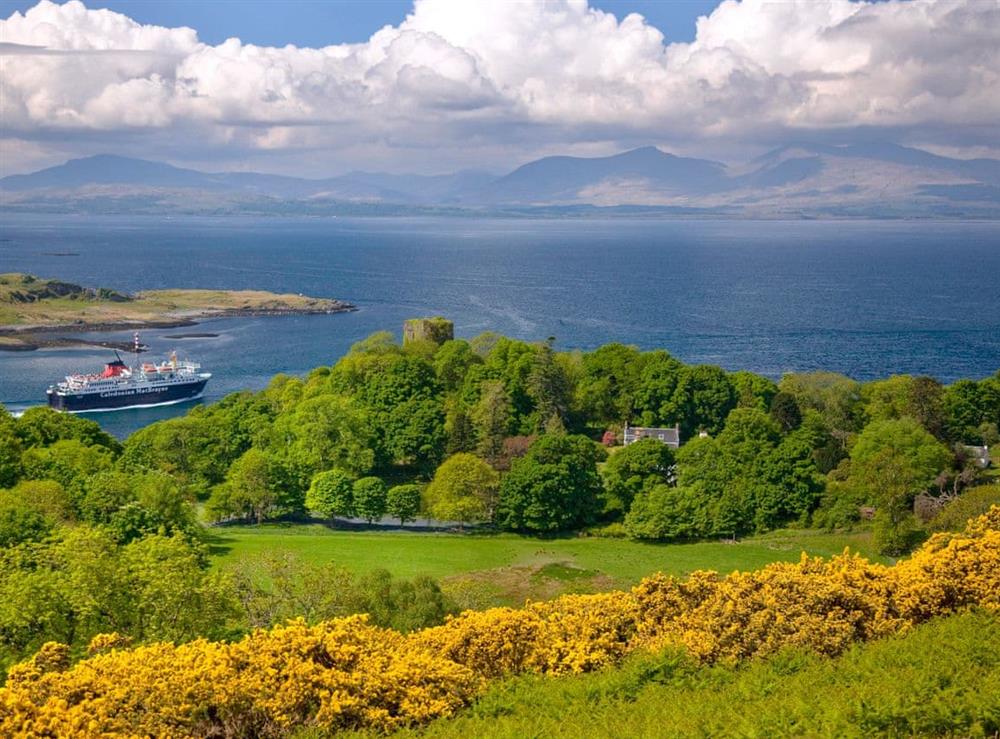 Mull ferry passes Dunollie from battleship hill