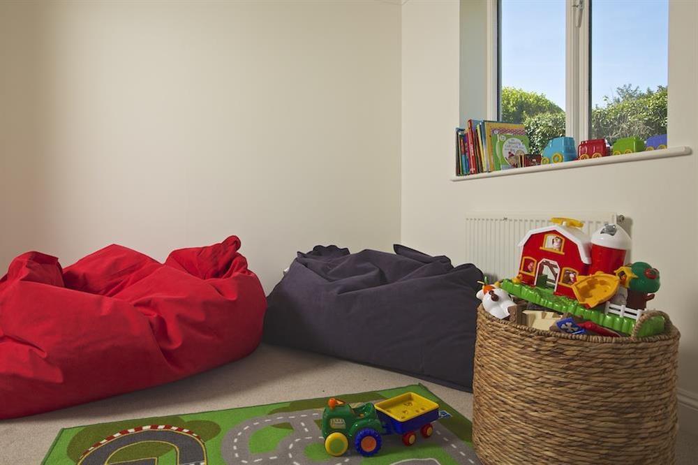 Children's playroom with beanbags, books and toys