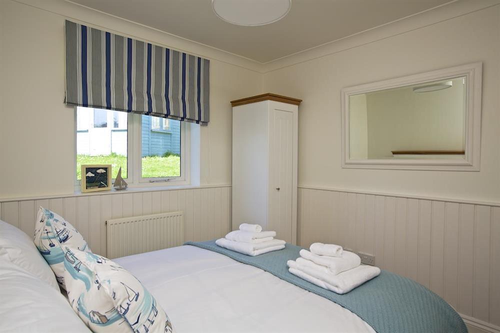 Double bedroom with corner wardrobe at Spindrift in , Thurlestone