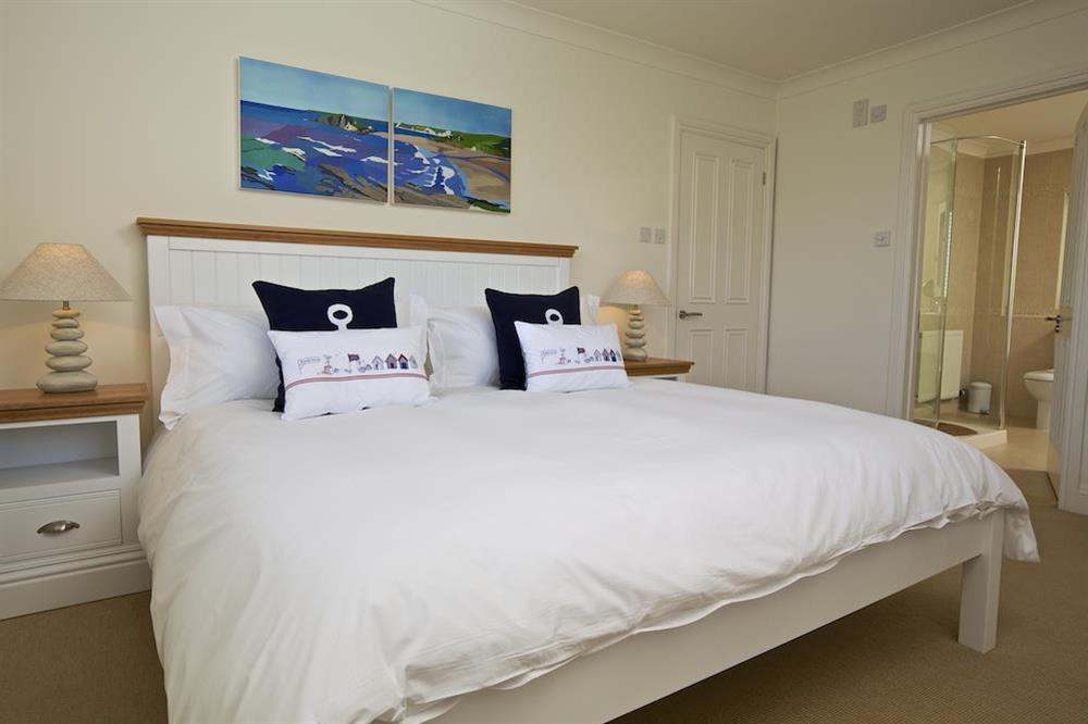 King's size bed in double bedroom at Spindrift in , Thurlestone