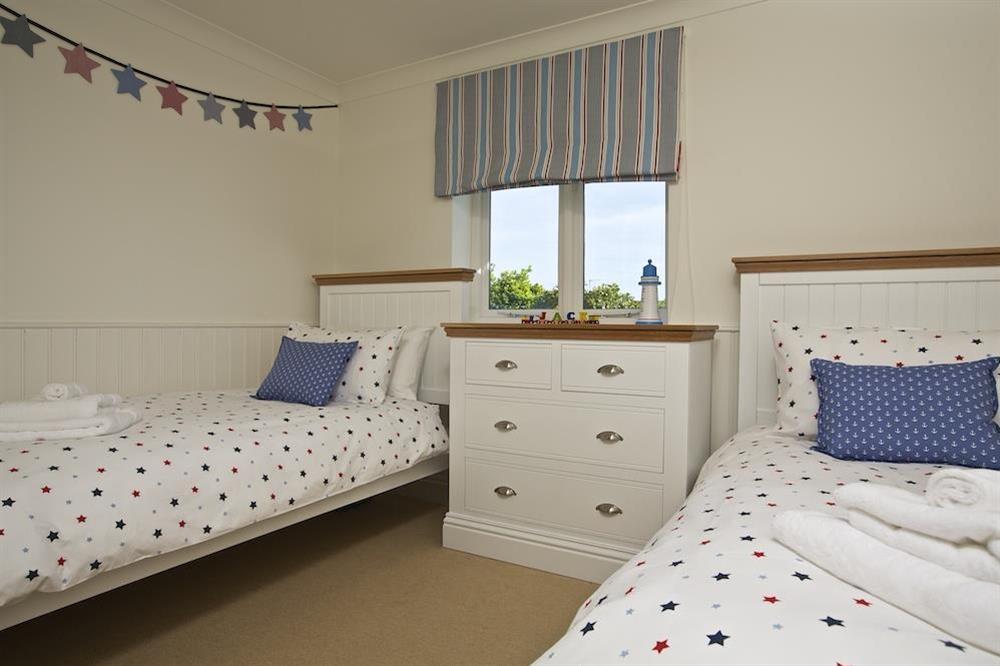Twin bedroom with chest of drawers at Spindrift in , Thurlestone