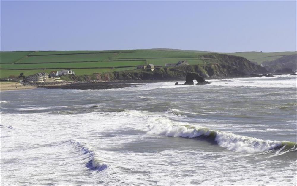 A view of Thurlestone Rock, with the cottage in the distance.  at Spinnaker in Thurlestone