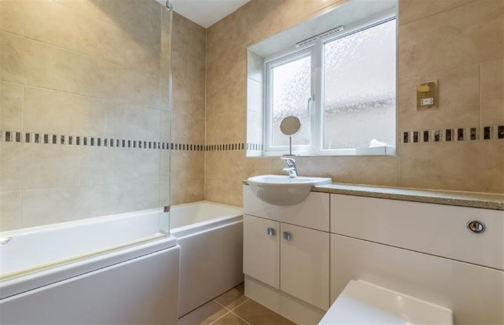 Ground floor: Family bathroom has bath with shower over at Spoonbills, Burnham Market near Kings Lynn
