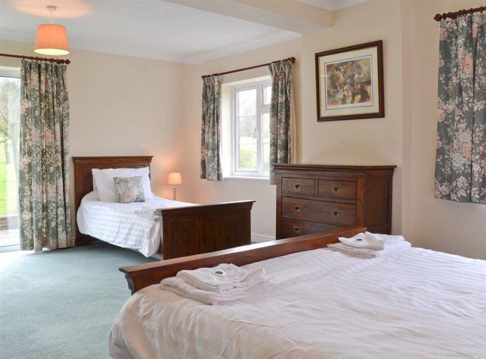 Double bedroom with additional single bed at Sporting Heights in Clows Top, near Kidderminster, Worcestershire