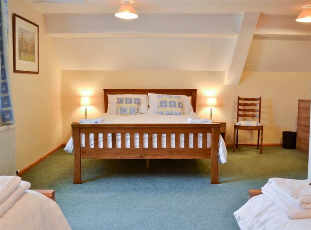 Double bedroom with additional twin beds (photo 2) at Sporting Heights in Clows Top, near Kidderminster, Worcestershire