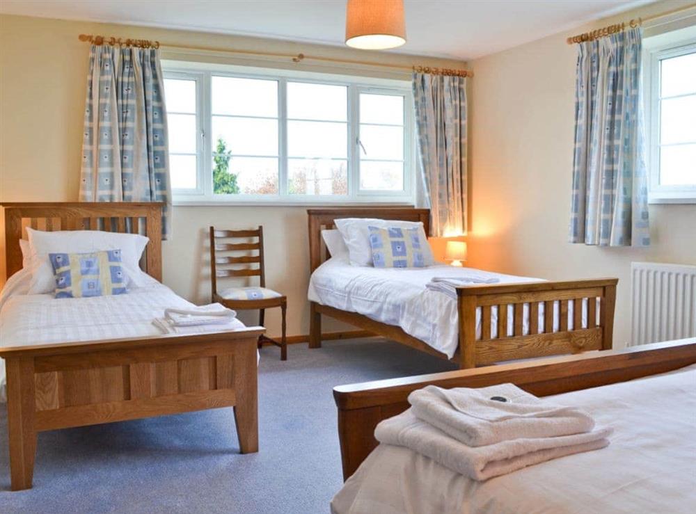 Double bedroom with additional twin beds (photo 3) at Sporting Heights in Clows Top, near Kidderminster, Worcestershire