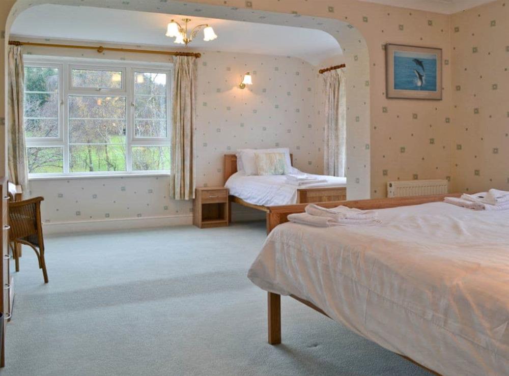 Double bedroom with additional twin beds at Sporting Heights in Clows Top, near Kidderminster, Worcestershire