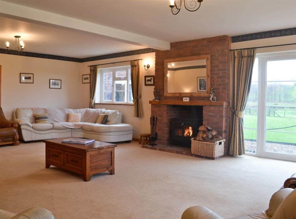 Large spacious living room with wood burning stove at Sporting Heights in Clows Top, near Kidderminster, Worcestershire