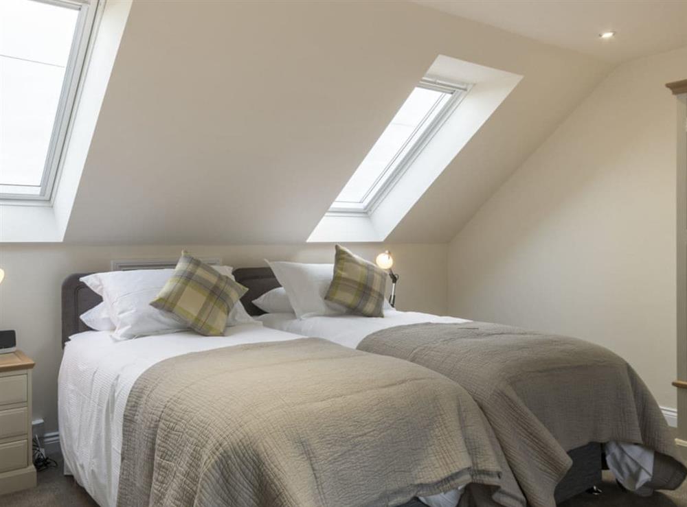 Restful twin bedroom at The Byre, 