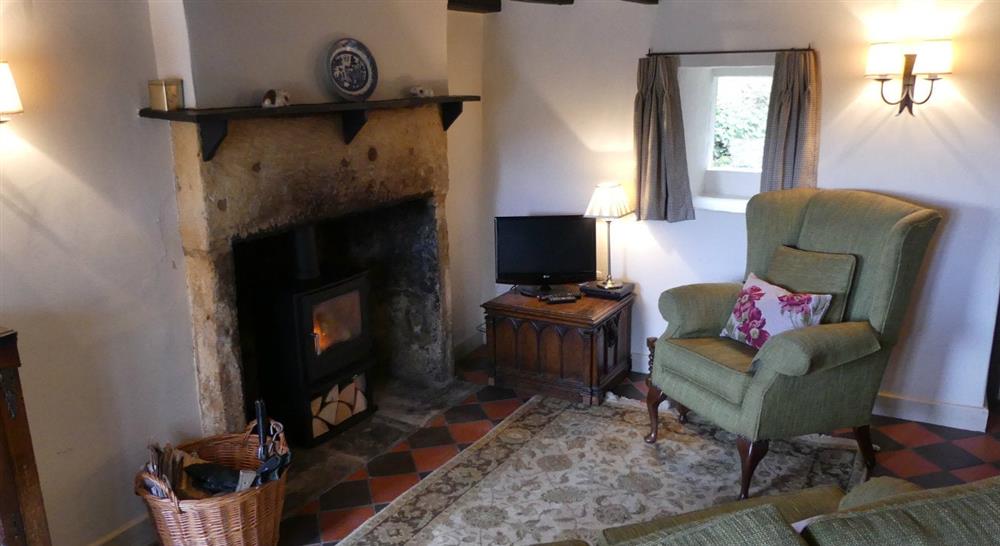 The cosy sitting room at Spring Cottage in Broadway, Gloucestershire