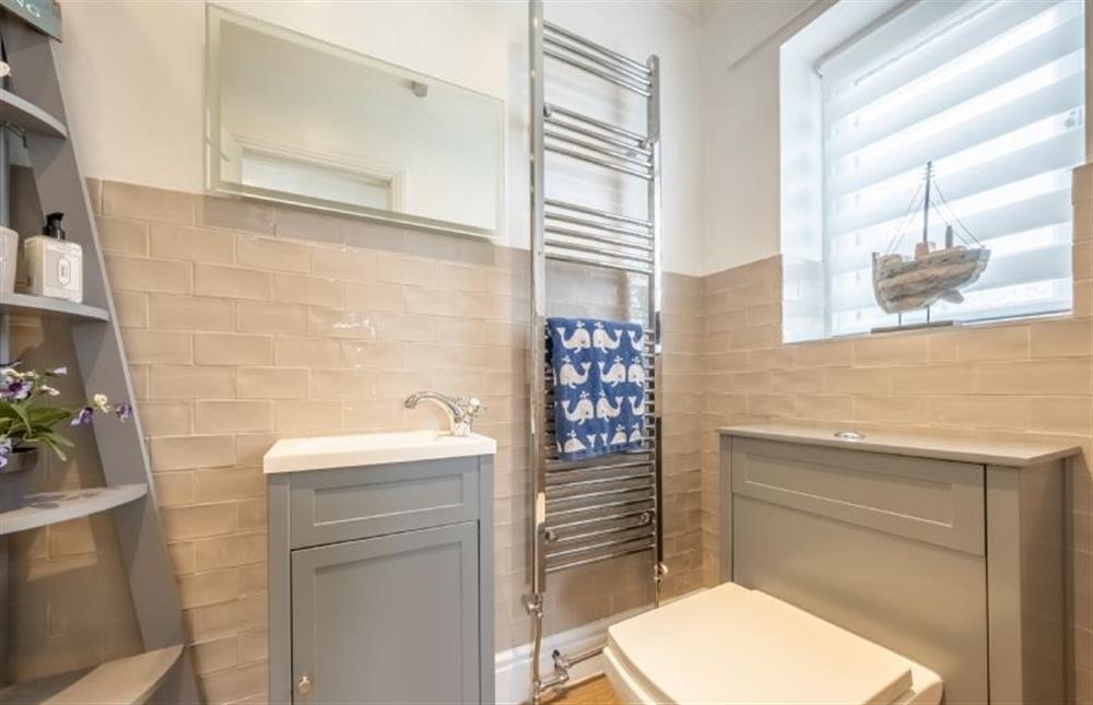 En-suite with shower cubicle, wash basin, heated towel rail and WC