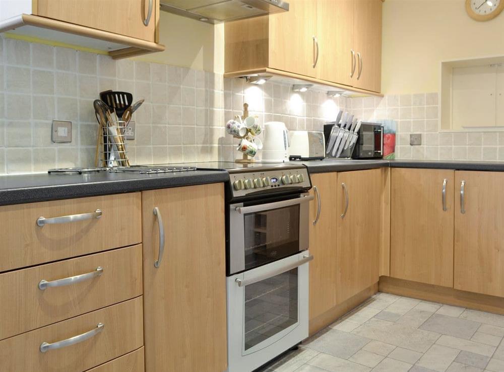 Well-equipped kitchen at Spring Mouse Apartment in Bowness-on-Windermere, Cumbria, England