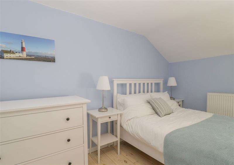 One of the 3 bedrooms at Spring Rose Cottage, Fortuneswell