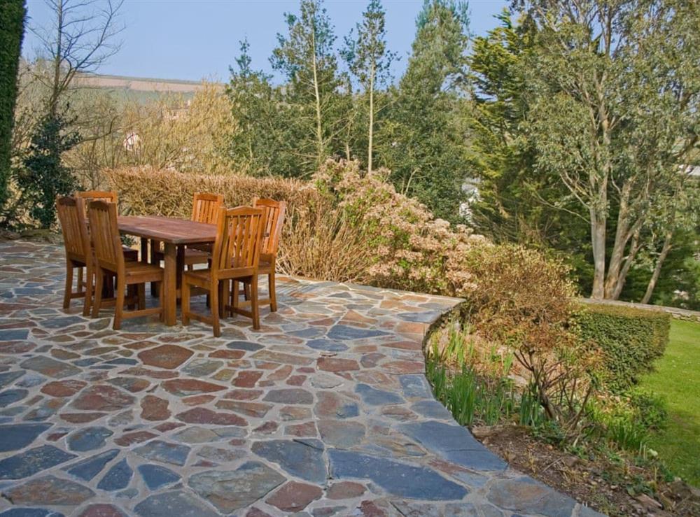 Two patio areas with outdoor furniture and BBQ at Spring Shaw in Higher Batson, Devon