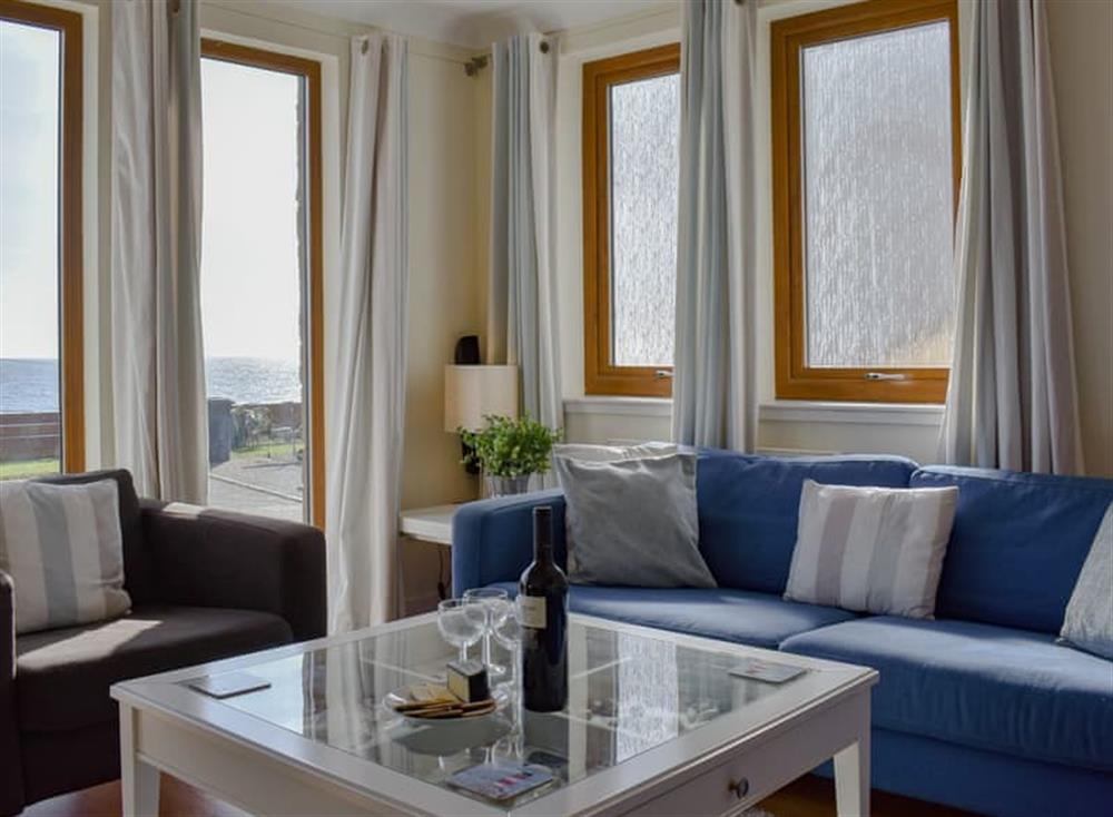 Comfortable living area with sea views at Springbank in Kildonan, Isle of Arran, Scotland