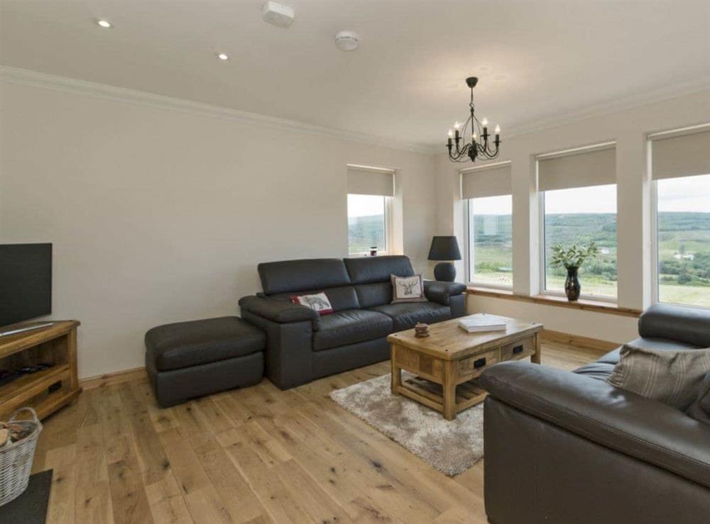 Stylishly furnished living room with cosy wood burner (photo 2) at Springbank in Upper Edinbane, near Portree, Isle Of Skye