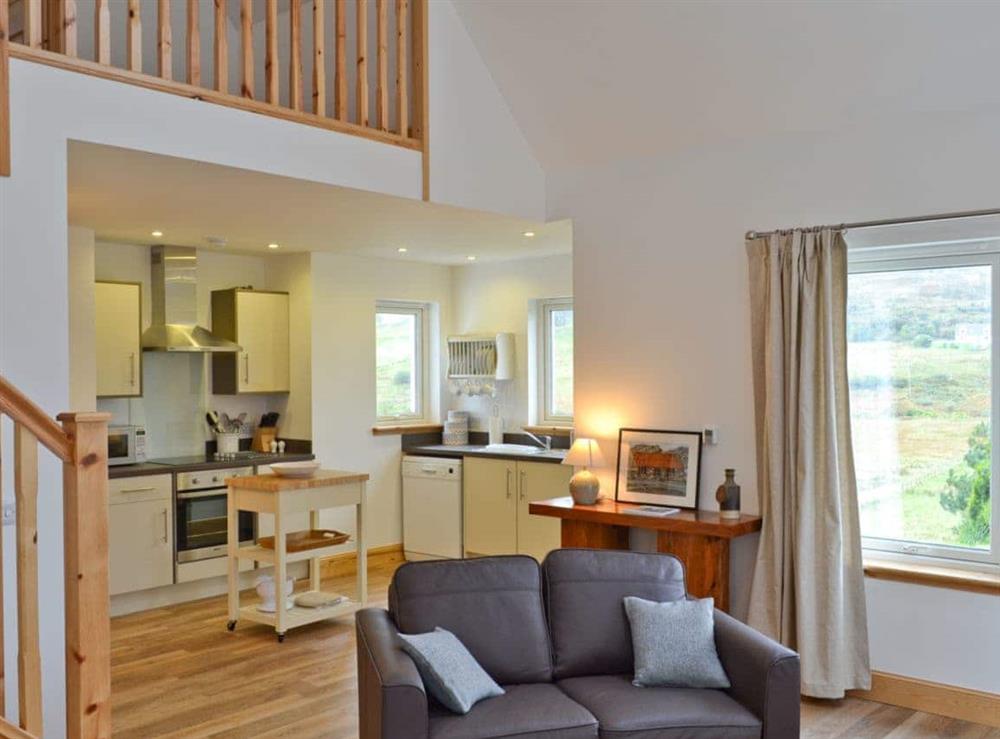 Open plan living/dining room/kitchen at Springburn Cottage in Fasach, near Dunvegan, Isle Of Skye