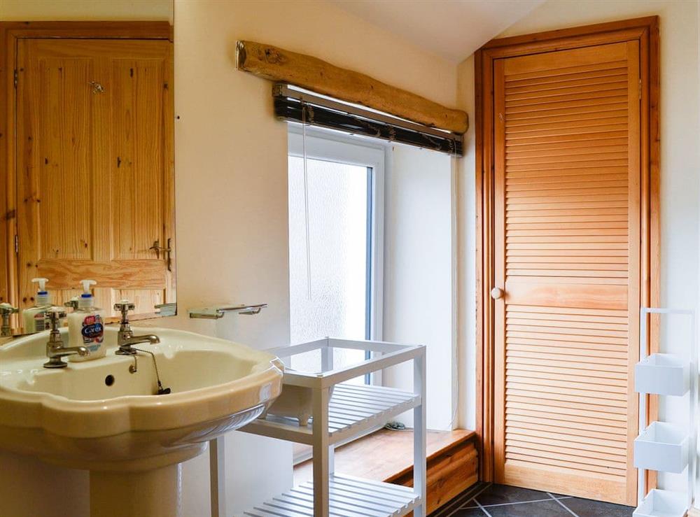 Bathroom with heated towel rail at Farm Cottage, 
