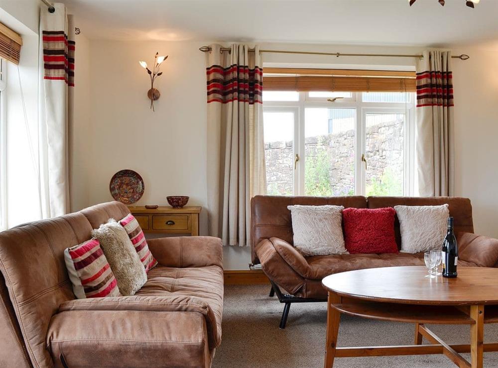 Cosy and comfortable living room at Farm Cottage, 