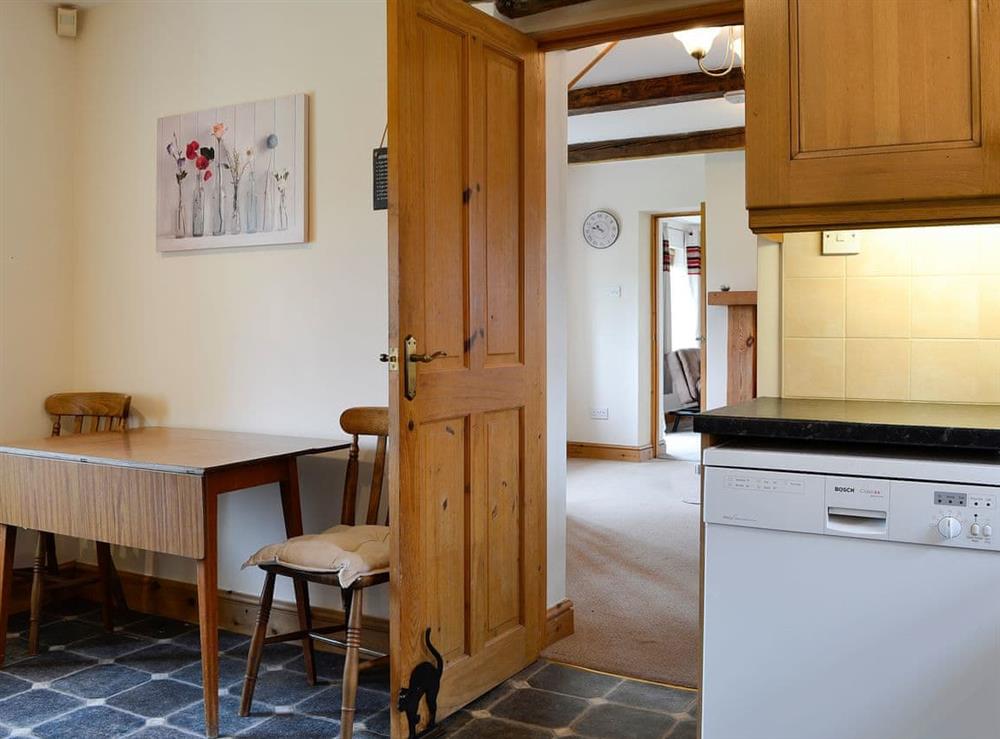 Kitchen with table and chairs at Farm Cottage, 