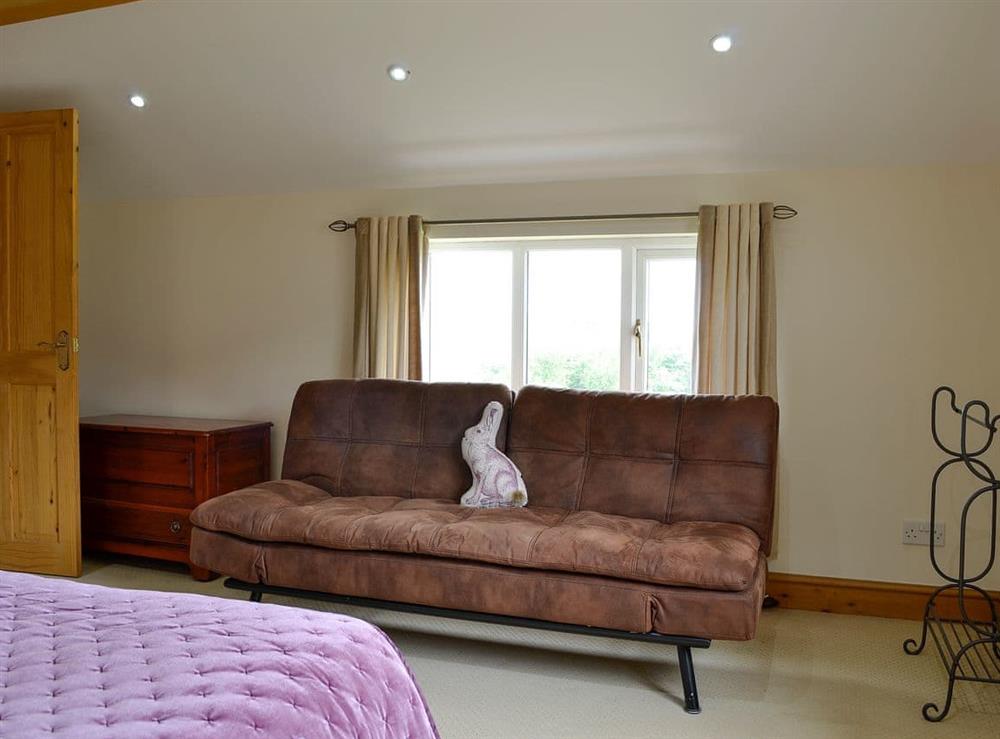 Relax in the comfortable double bedroom at Farm Cottage, 