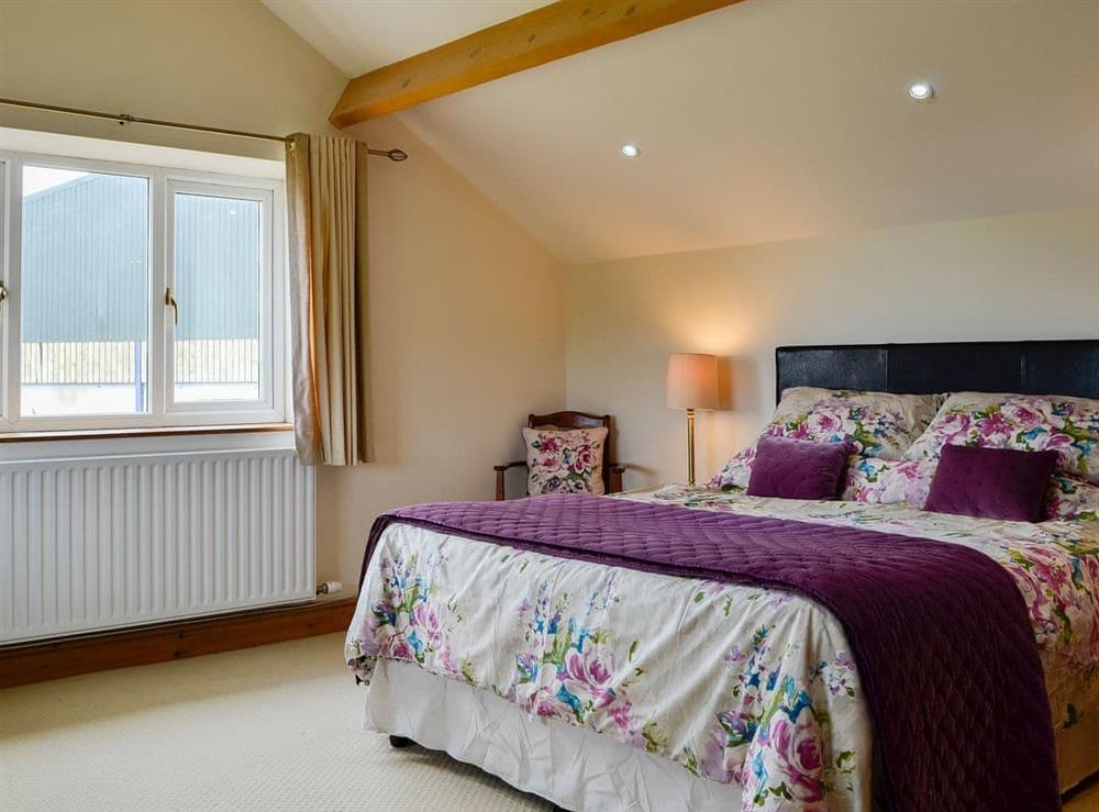 Roomy double bedroom at Farm Cottage, 