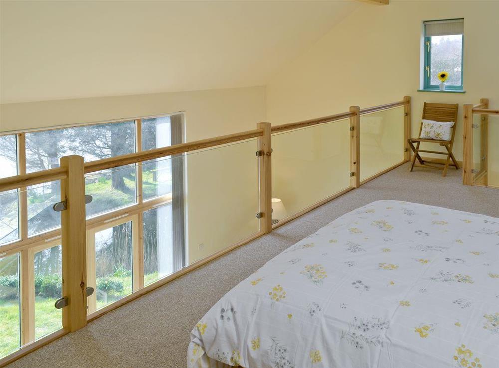 Modern design double bedroom on mezzanine at Kingfisher Lodge, 