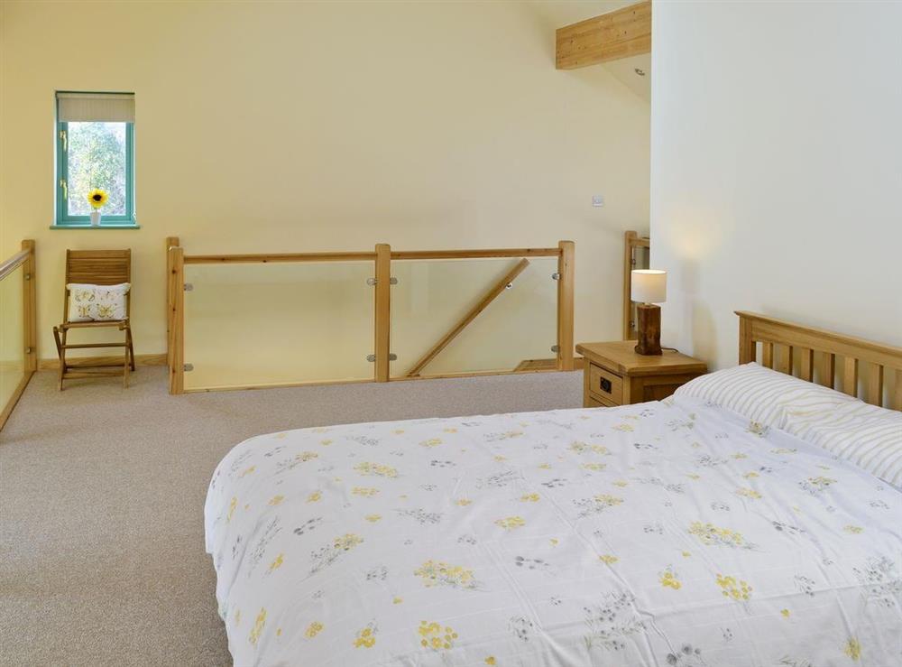 Open-aspect double bedroom at Kingfisher Lodge, 