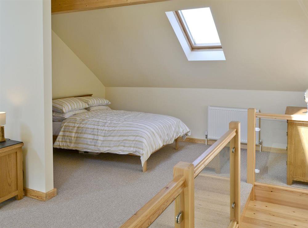 Additional double bed on mezzanine level at Orchid Lodge, 