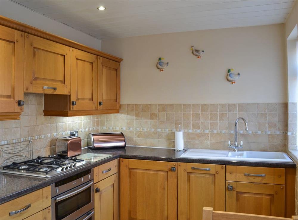 Delightfully half-tiled kitchen at Squirrel Cottage in Seamer, near Scarborough, North Yorkshire
