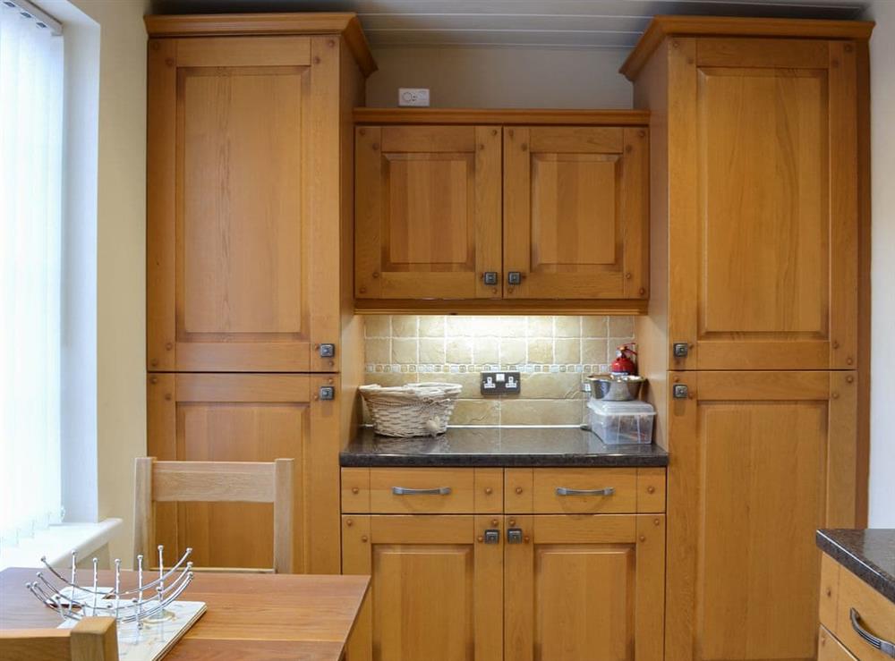 Spacious kitchen with dining area at Squirrel Cottage in Seamer, near Scarborough, North Yorkshire