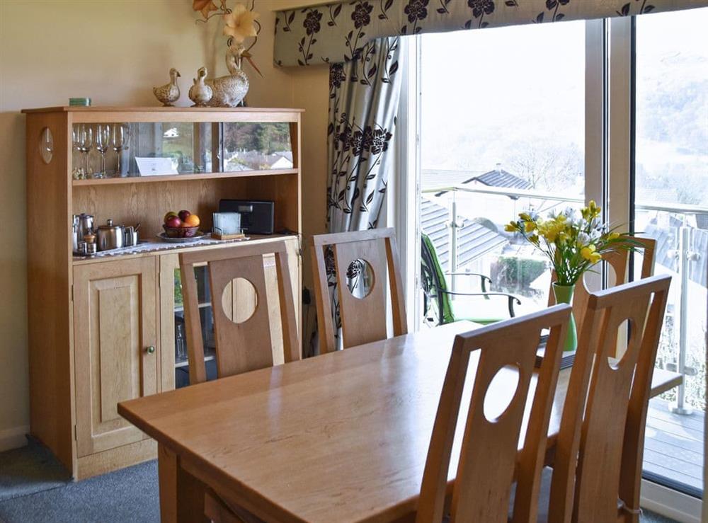 Stylish dining area with access to the balcony at 12 Badgers Rake, 