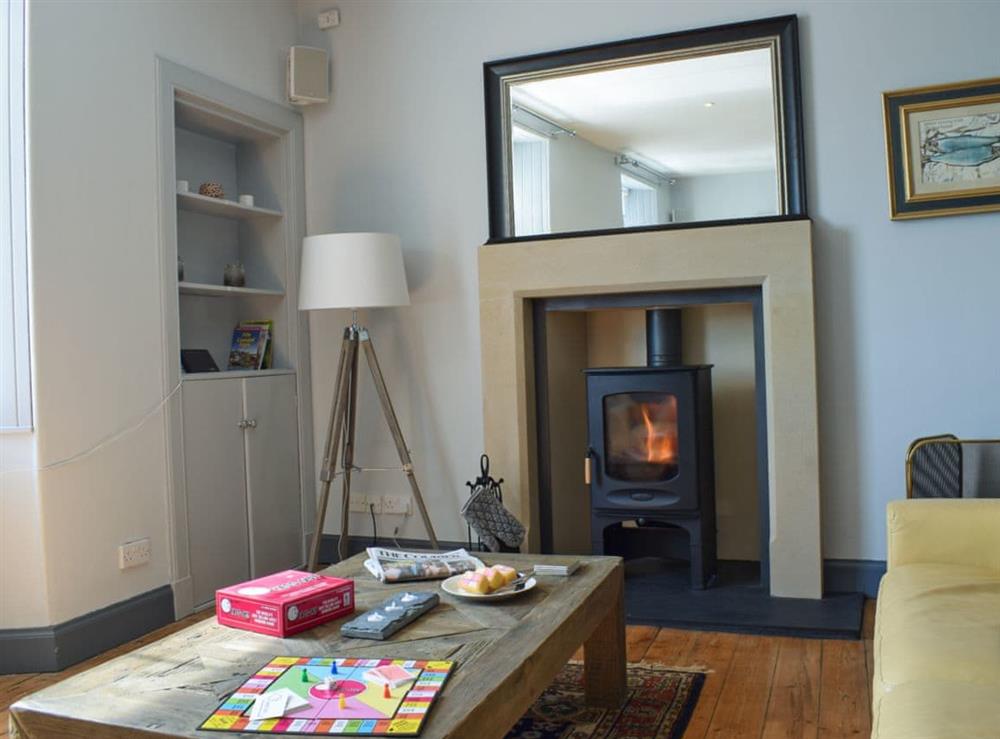 Living area with wood burner at St Andrews in Pittenweem, near Anstruther, Fife