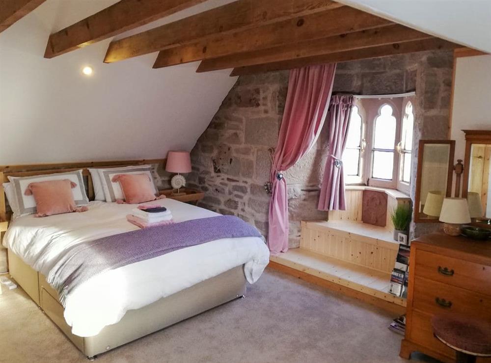 Relaxing bedroom with kingsize bed at St Brighs in Dingwall, Ross-Shire