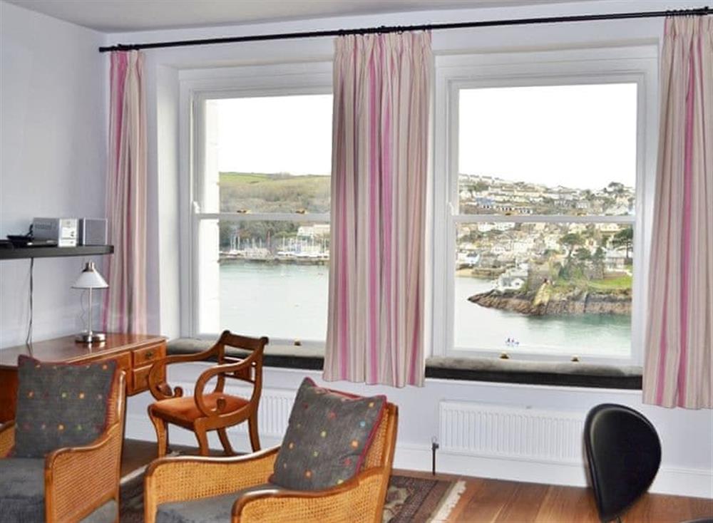 The large picture windows with window seats offer panoramic river and sea views at St Catherines Court No 4 in Fowey, Cornwall