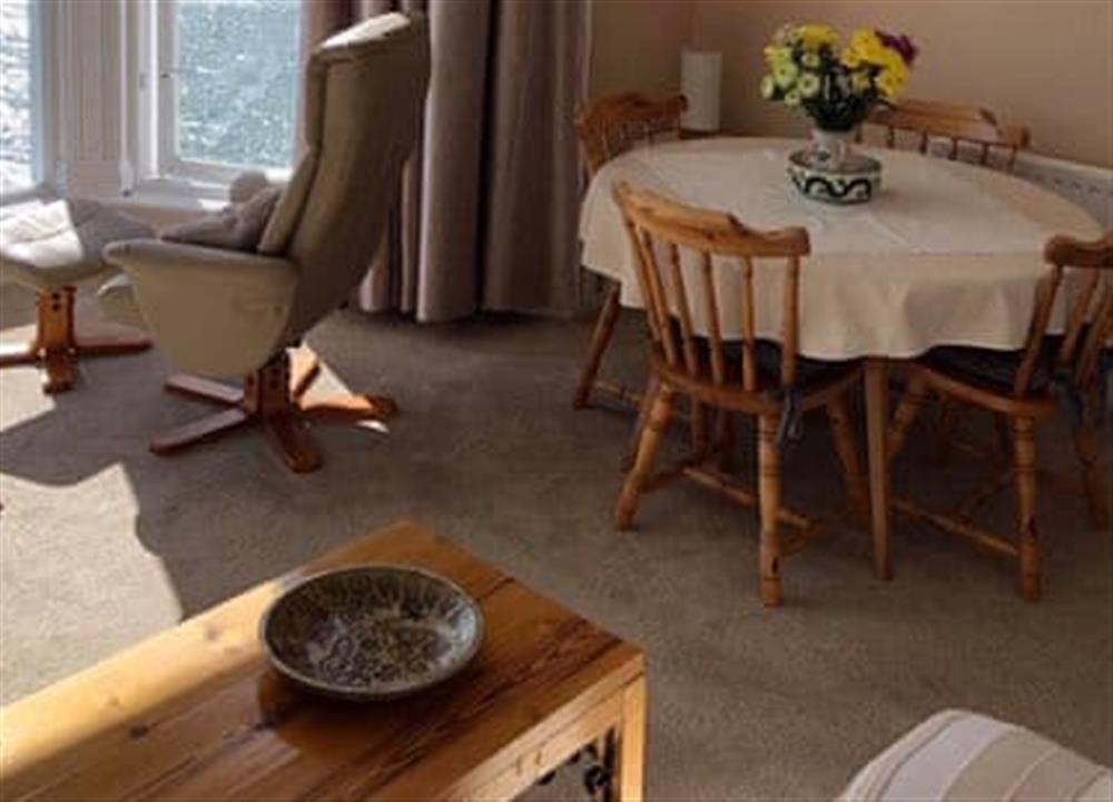The living and dining area has stunning views at St Catherines Court No 7 in Fowey, Cornwall